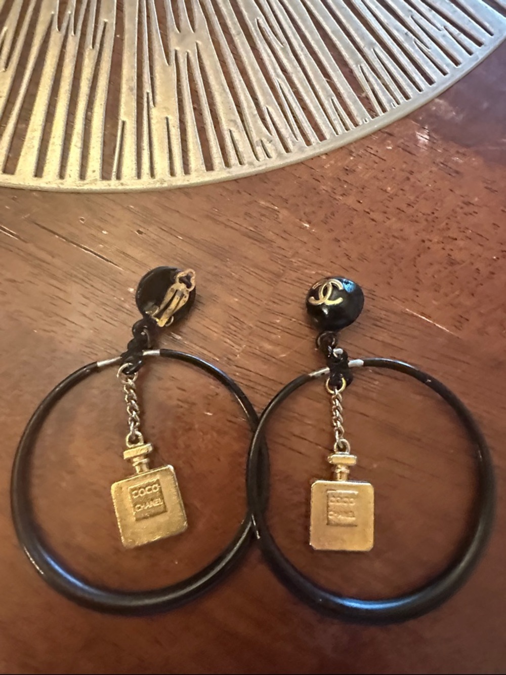 CHANEL Black and Gold Hoop Earrings with Perfume Bottle Charm